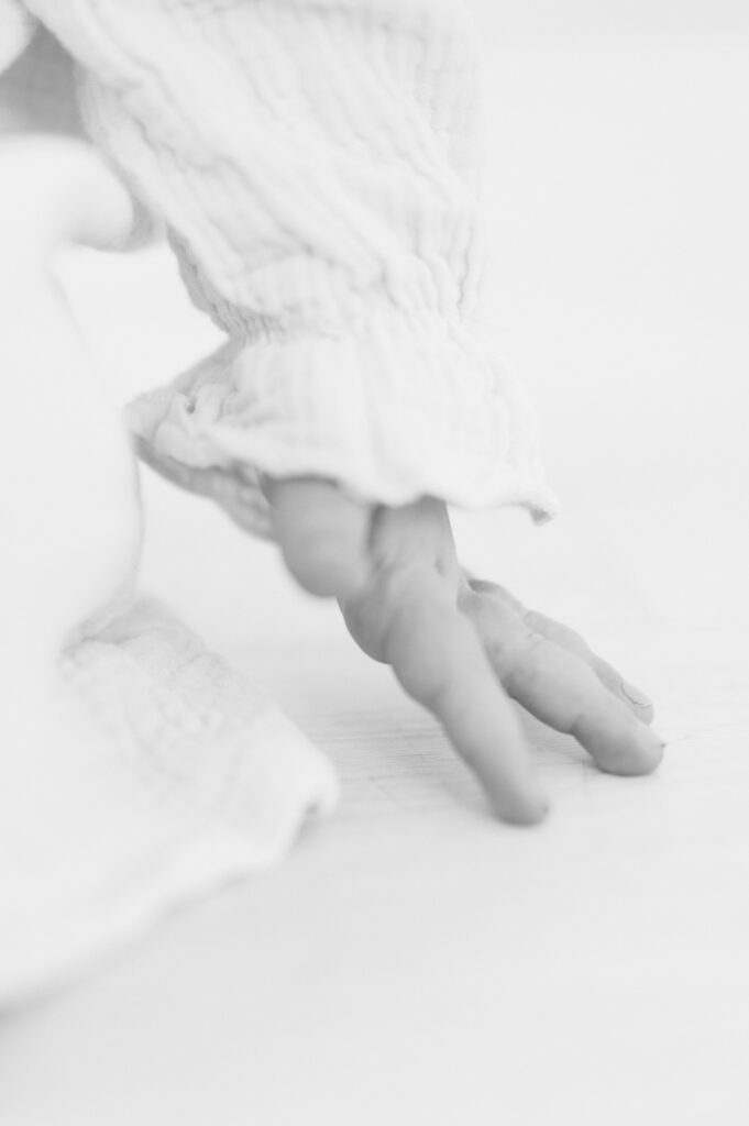 detail photo of hand touching floor