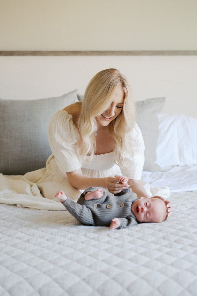 mom soothes newborn baby boy 