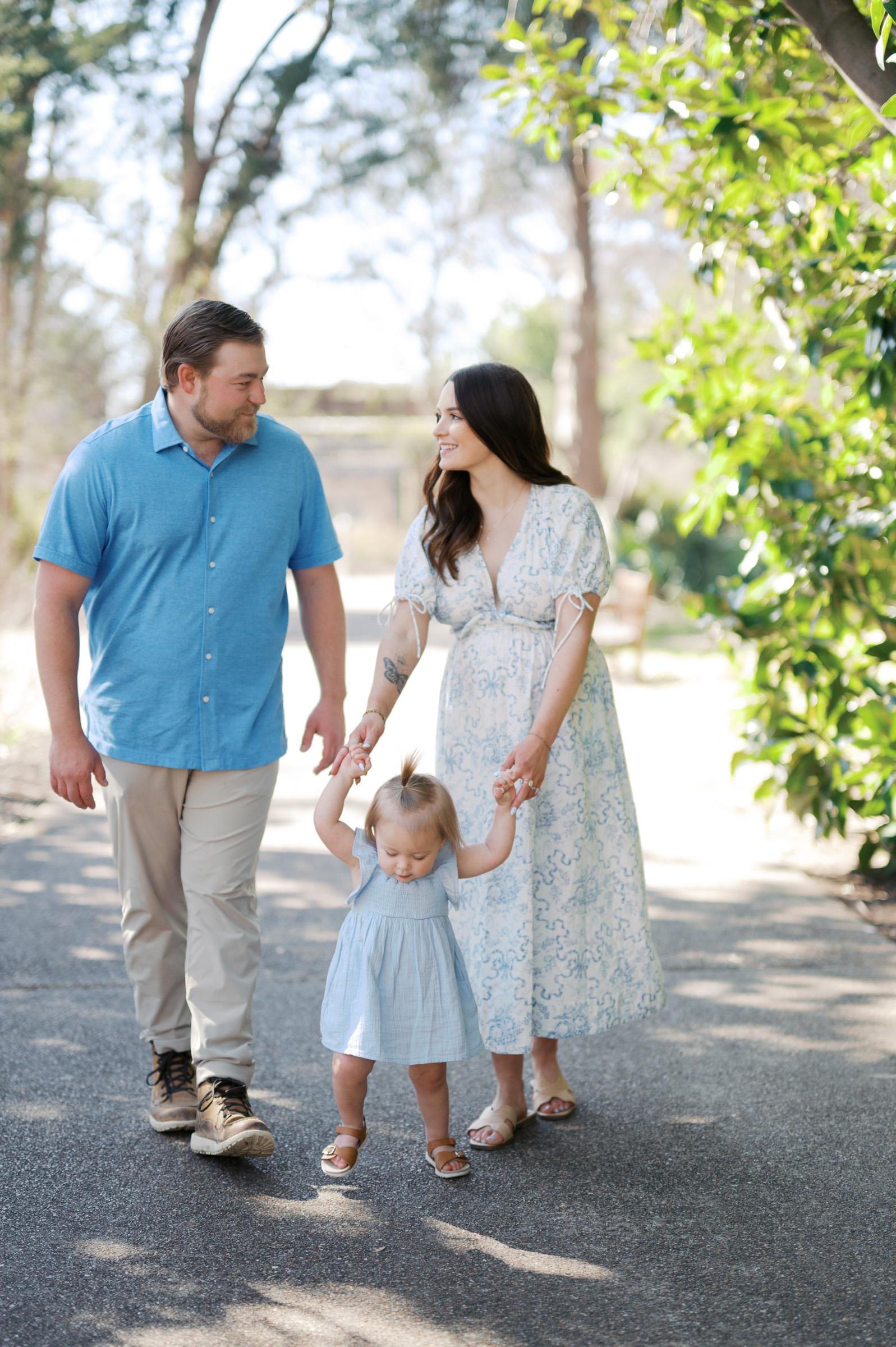 family photo of 3 at the fort worth botanic garden