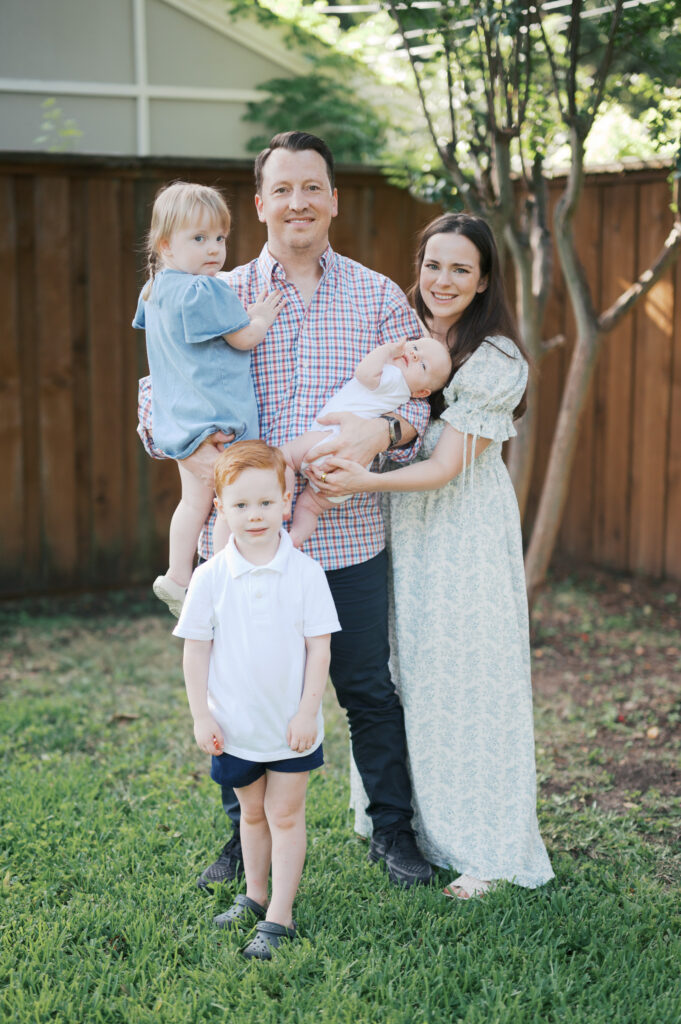 family of 5 smile for a family photo 