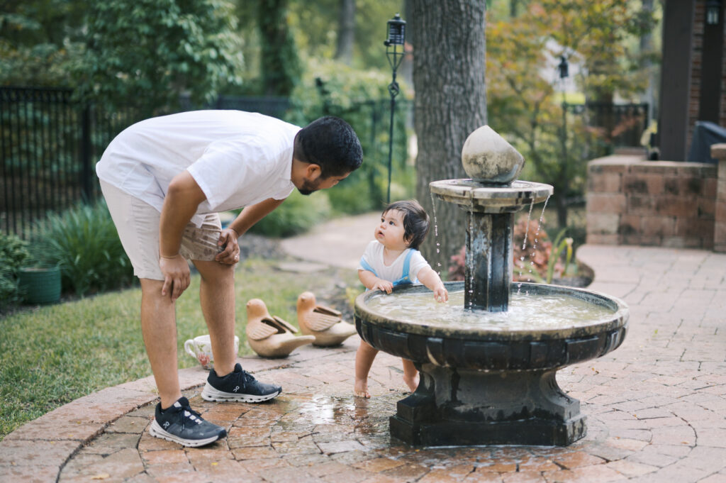 family-friendly things to do this summer, backyard family photos, father and son playing in the backyard during a photo session in fort worth