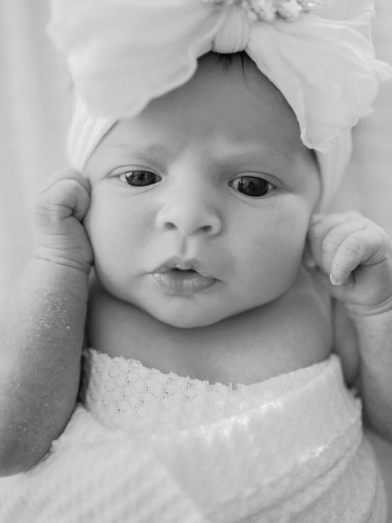 newborn baby looks straight ahead