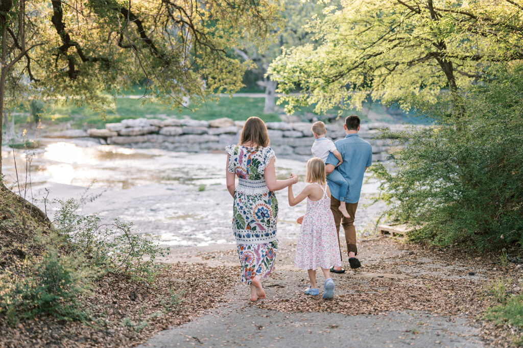 family-friendly things to do in fort worth, family walking through creek in airfield falls