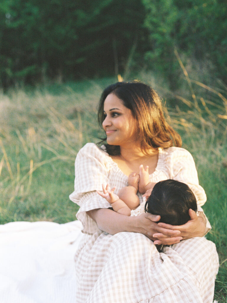 motherhood portrait of mom and six month old baby outdoors on film