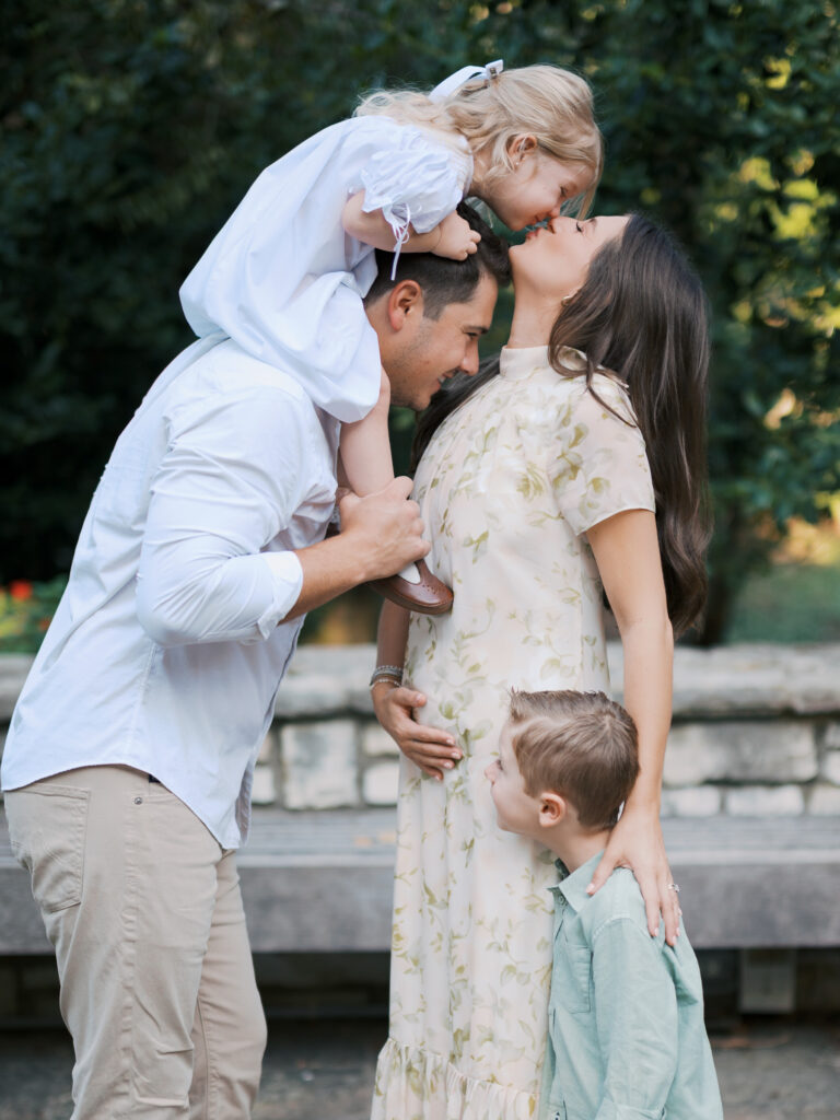 family of four gathers during pregnancy announcement photos at the fort worth botanic garden