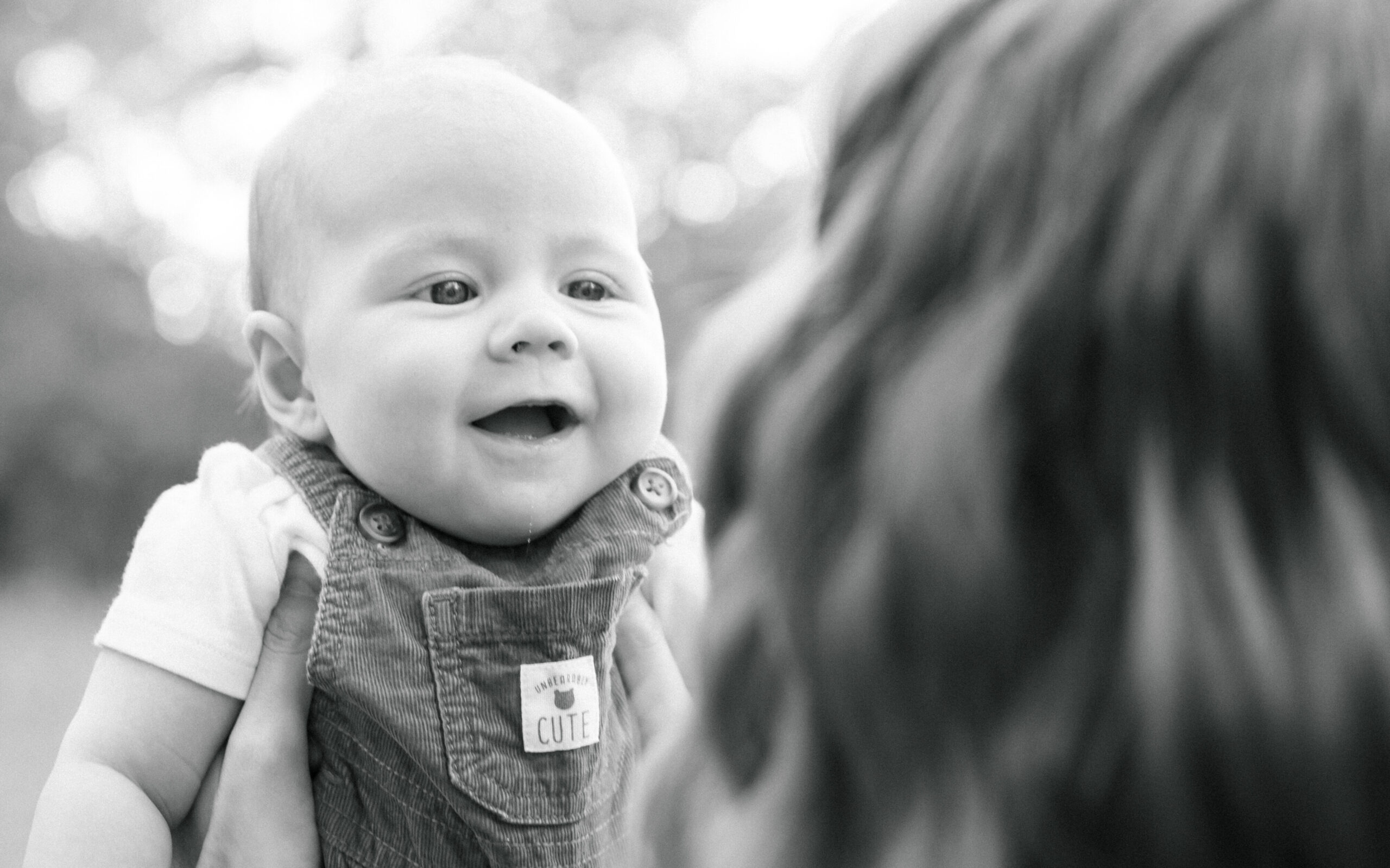 baby smiles at mom
