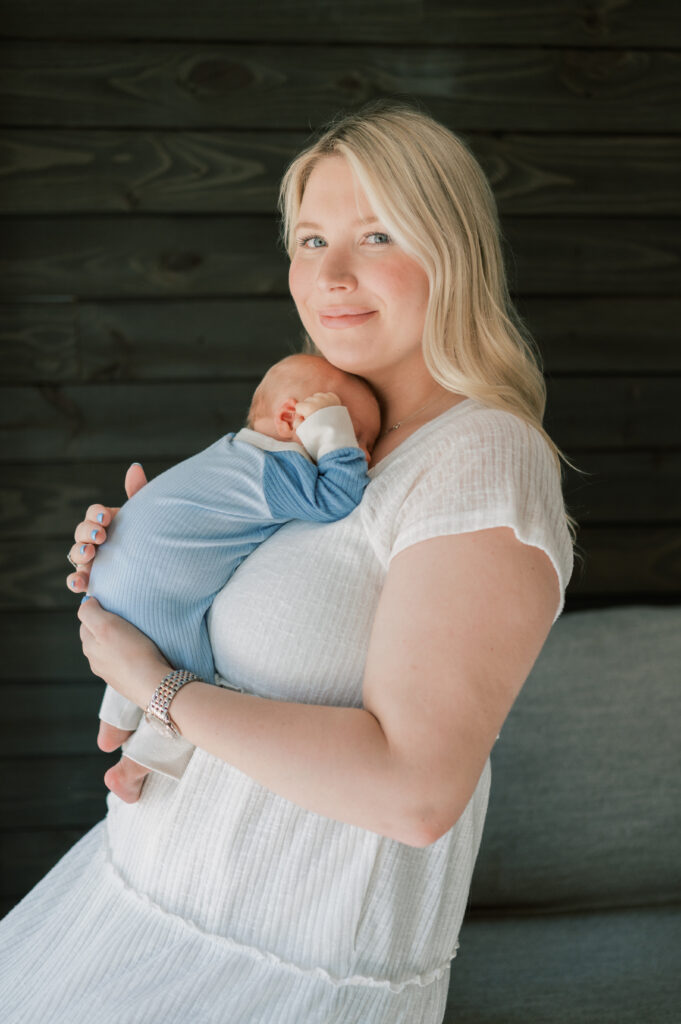 fort worth photographer captures mom holding baby newborn