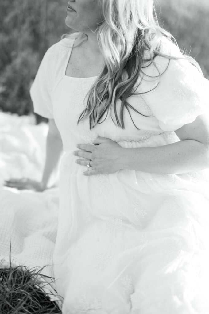 expecting mom embraces bump