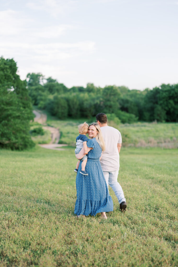 mom looks back at camera during family photo session 