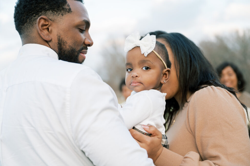 girl looks back at camera during family photography session