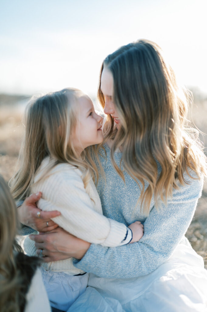 winter family photos by a lake in fort worth dallas