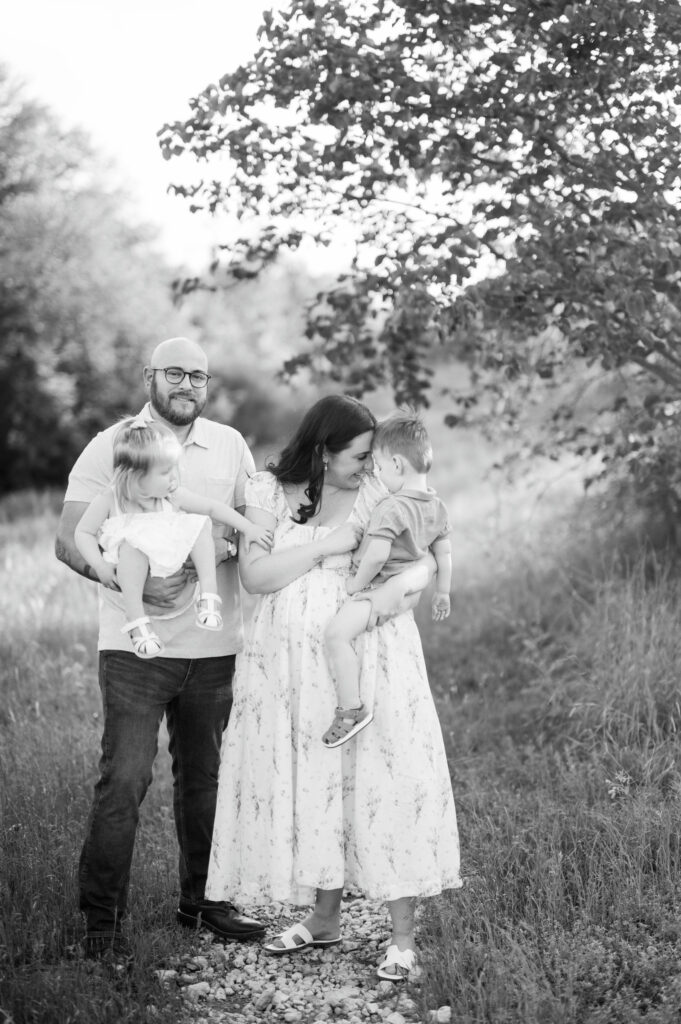 maternity portrait in black and white during family session expecting twins