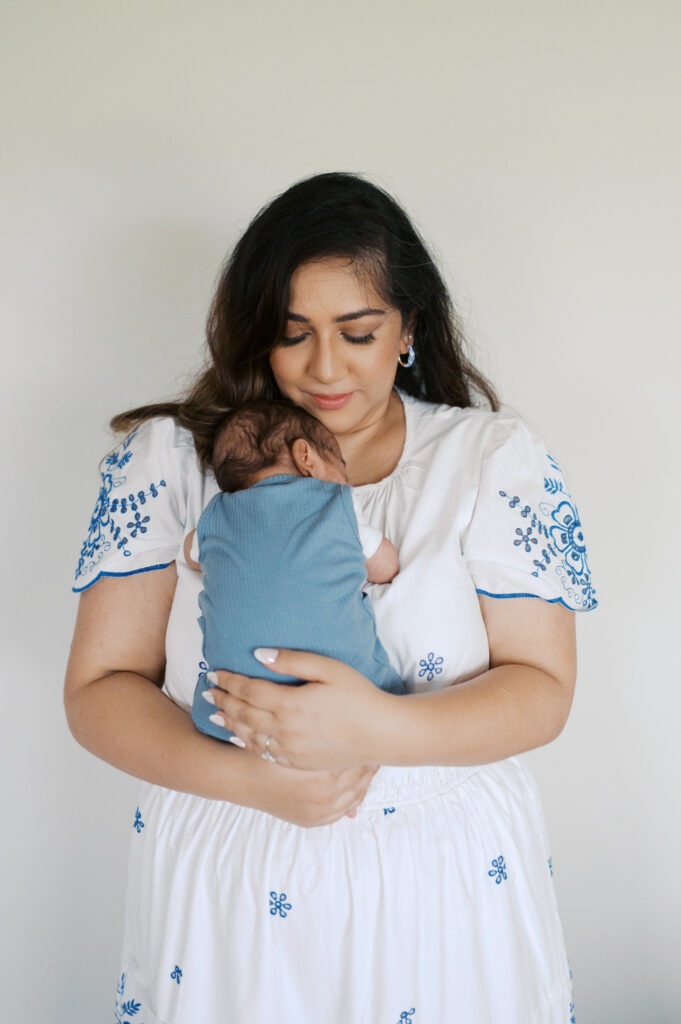 fort worth newborn photographer, mom holds baby