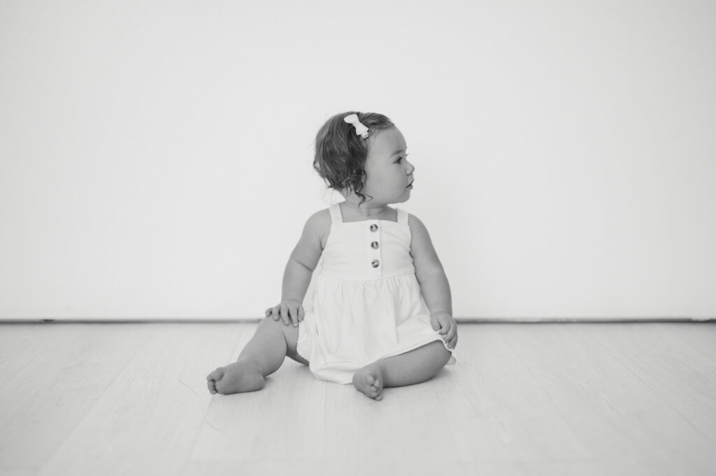 black and white portrait milestone photo of one year old