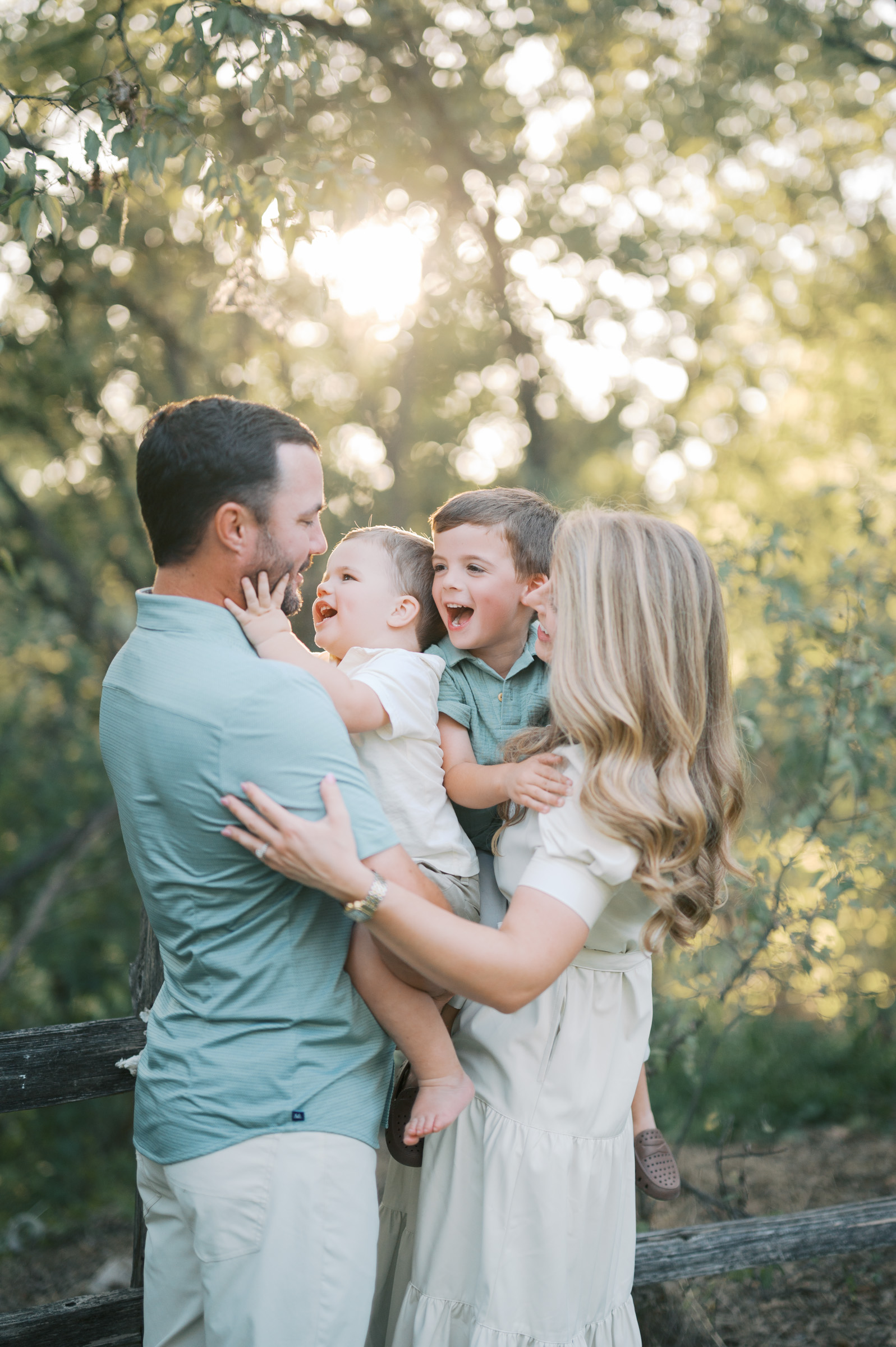 Fort Worth Lifestyle Family Photographer, family of four cuddles close