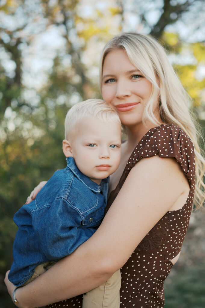 mom and son cuddle close during family photography session