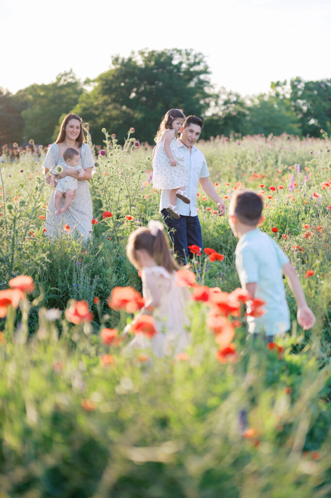 family walking through wildflowers