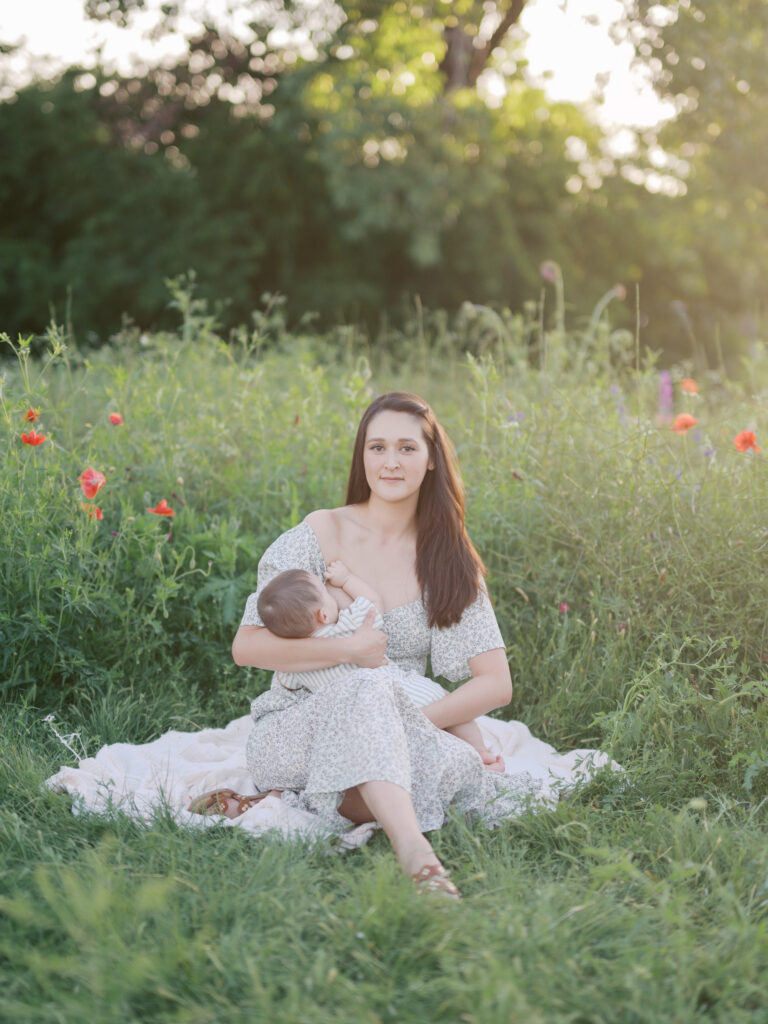 mom poses for a portrait during family spring photos in wildflower field in DFW